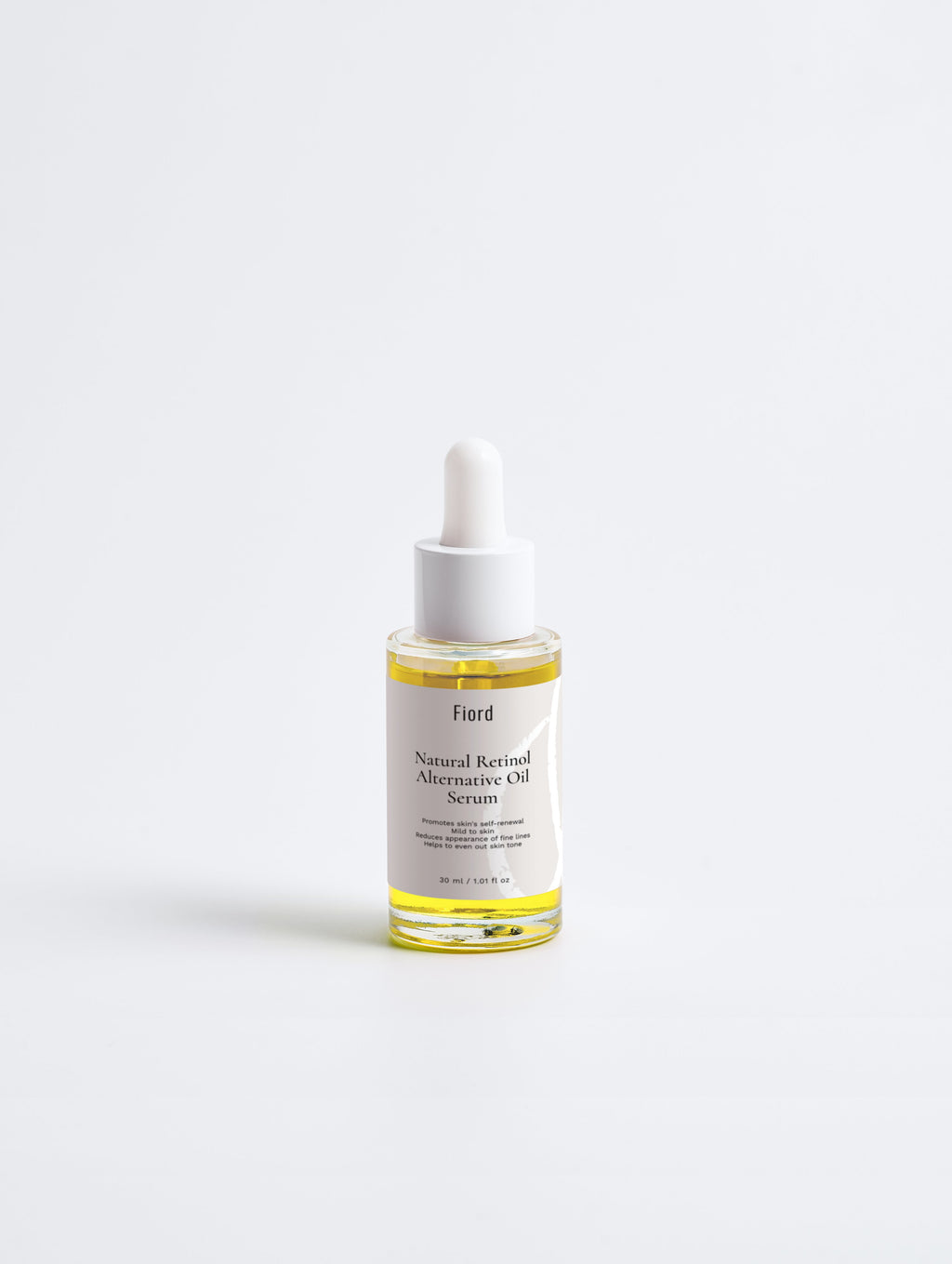 Bottle of Bakuchiol Retinol Oil with dropper on a white background
